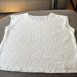 White embroidery roses on front of a short sleeve top